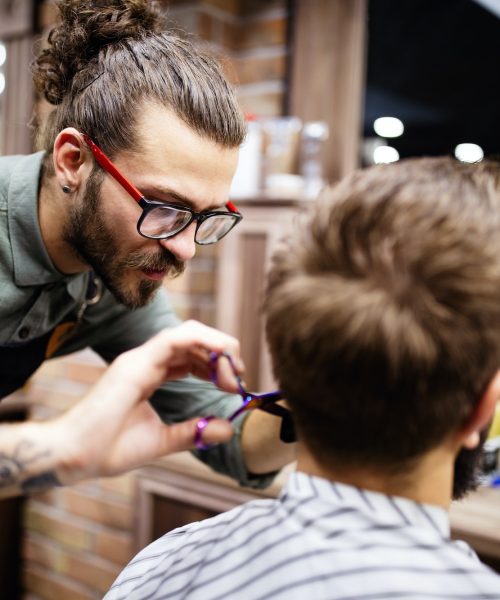 client-during-beard-and-moustache-grooming-in-barber-shop.jpg
